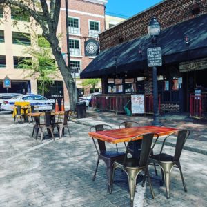 view of outdoor seating in front of the restaurant