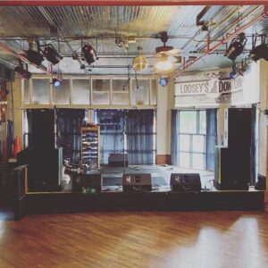 Photo of the Mainstage at Loosey's during the daytime. For Decoration only.